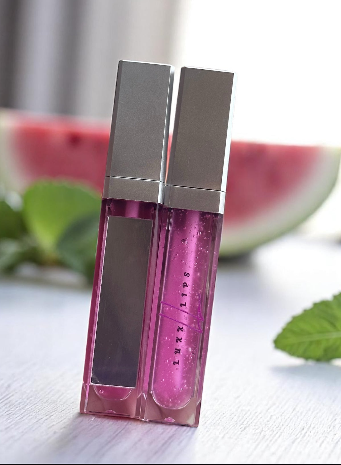 Wealthy Watermelon Lip Gloss with juicy watermelon flavor and sheer finish.